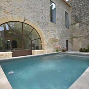 Verrière cintrée sur une façade en pierre 1 - Verrière - site CMT Métallurgie